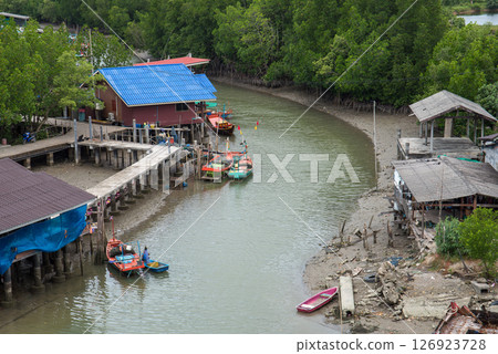 Fishing boats in sea and mangrove forest of Thailand 126923728