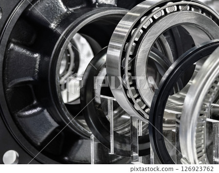 Detailed view of precision metal bearings and components displayed in a modern industrial setting 126923762