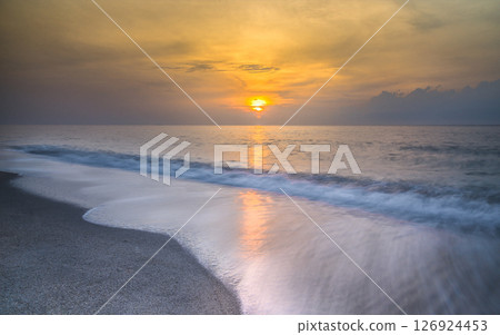 Morning sunrise at the beach Morning sunrise at the beach 126924453