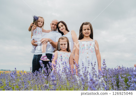 The lavender field surrounds the family with its magical atmosphere 126925046