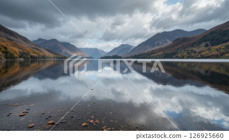 Stunning Mountain Lake Reflection with Autumn Colors and Clouds 126925660