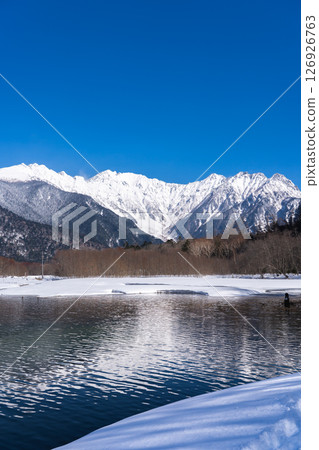 Taisho Pond, snow-covered Mount Okuhotaka and Tsuri Ridge, winter trekking in Kamikochi, Matsumoto City, Nagano Prefecture 126926763