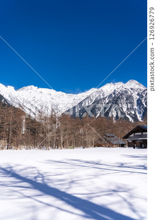 Okuhotakadake and Tsurione ridge seen from Kamikochi bus terminal. Winter trekking in Kamikochi, Matsumoto city, Nagano prefecture. Okuhotakadake and Tsurione ridge seen from Kamikochi bus terminal. Winter trekking in Kamikochi, Matsumoto city, Nagano prefecture. 126926779