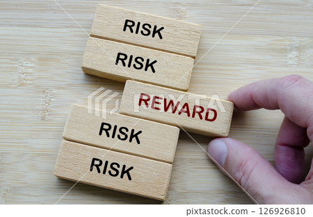 Risk and Reward text, depicting the classic decision making dilemma of weighing risk against reward in any venture Risk and Reward text, depicting the classic decision making dilemma of weighing risk against reward in any venture 126926810