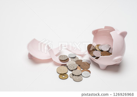 Broken piggy bank and coins Broken piggy bank and coins 126926968