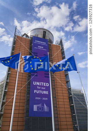 Waving EU flags in front of the Berlaymont building headquarters of the European Commission on May 20, 2025 in Brrussels, Belgium. 126927316