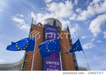Waving EU flags in front of the Berlaymont building headquarters of the European Commission on May 20, 2025 in Brrussels, Belgium. Waving EU flags in front of the Berlaymont building headquarters of the European Commission on May 20, 2025 in Brrussels, Belgium. 126927317