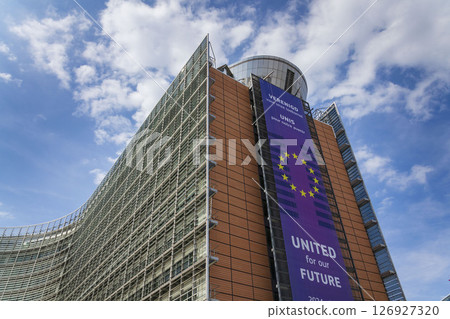 Waving EU flags in front of the Berlaymont building headquarters of the European Commission on May 20, 2025 in Brrussels, Belgium. 126927320