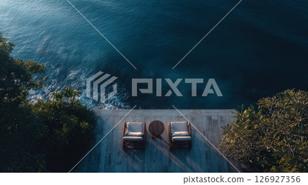 Oceanfront Lounge with Coastal View from a Luxurious Deck Oceanfront Lounge with Coastal View from a Luxurious Deck 126927356