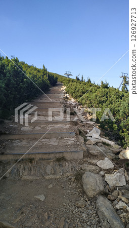 Hiking trail leading to snezka mountain peak in czech republic in august 126927713