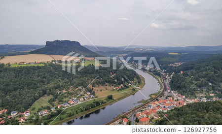 Lilienstein mountain dominating saxon switzerland landscape with elbe river flowing through konigstein, germany 126927756
