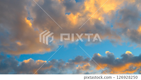 Beautiful sky background - Sunset (Sunrise) sky with light clouds. 126928250