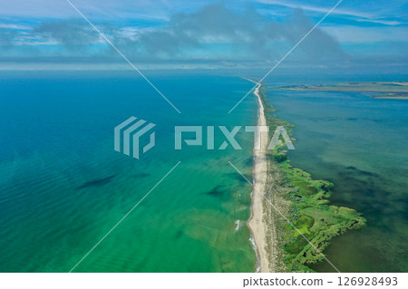 Aerial drone photo of tropical exotic sand bar in wild bay, Cloud shadows are visible on the water and sand. Aerial drone photo of tropical exotic sand bar in wild bay, Cloud shadows are visible on the water and sand. 126928493