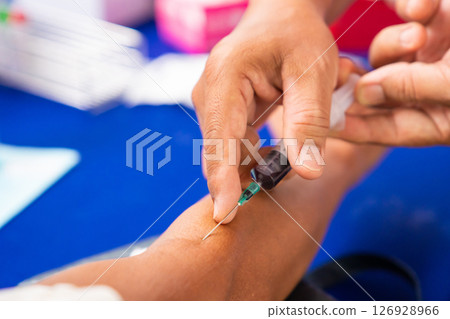 Close up hand collecting blood sample for diagnosis and treatment patient in the hospital.Laboratory technician taking blood for blood chemistry analysis Close up hand collecting blood sample for diagnosis and treatment patient in the hospital.Laboratory technician taking blood for blood chemistry analysis 126928966