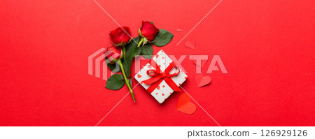 Valentine's day composition with rose flower, red heart and gift boxes on table. mother day and birthday greeting, copy space, top view 126929126