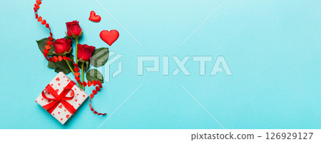 Valentine's day composition with rose flower, red heart and gift boxes on table. mother day and birthday greeting, copy space, top view Valentine's day composition with rose flower, red heart and gift boxes on table. mother day and birthday greeting, copy space, top view 126929127