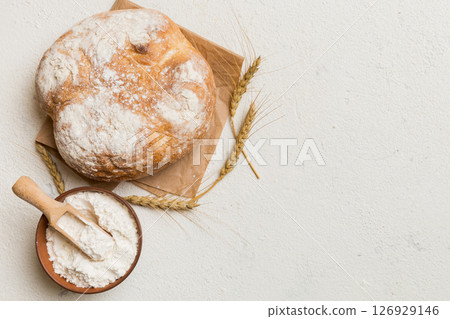 Fresh homemade crisp round bread on napkin, top view. Healthy unleavened bread. French bread. Top view Bakery products Fresh homemade crisp round bread on napkin, top view. Healthy unleavened bread. French bread. Top view Bakery products 126929146