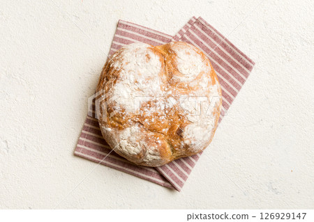 Fresh homemade crisp round bread on napkin, top view. Healthy unleavened bread. French bread. Top view Bakery products Fresh homemade crisp round bread on napkin, top view. Healthy unleavened bread. French bread. Top view Bakery products 126929147