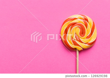 Set of colorful lollipops on colored background. Summer concept. Party Happy Birthday or Minimalist Concept Set of colorful lollipops on colored background. Summer concept. Party Happy Birthday or Minimalist Concept 126929198