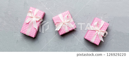 Valentine day composition Background: red gift box with bow and heart. Christmas present. View from above. Holday greeting card 126929220