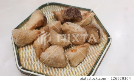close up of deep fried Taiwanese snacks king trumpet mushroom cut into pieces on a plate close up of deep fried Taiwanese snacks king trumpet mushroom cut into pieces on a plate 126929364
