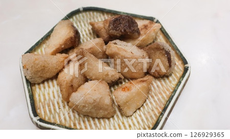 close up of deep fried Taiwanese snacks king trumpet mushroom cut into pieces on a plate close up of deep fried Taiwanese snacks king trumpet mushroom cut into pieces on a plate 126929365