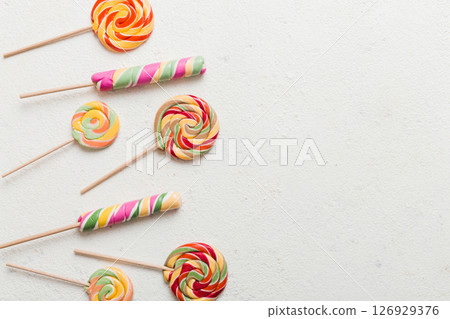 Set of colorful lollipops on colored background. Summer concept. Party Happy Birthday or Minimalist Concept 126929376