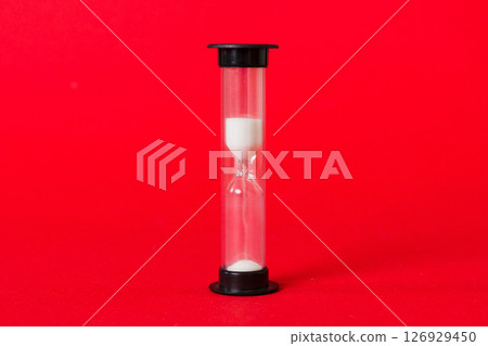 hourglass on the table, sand clock as time passing concept for business deadline, copy space hourglass on the table, sand clock as time passing concept for business deadline, copy space 126929450
