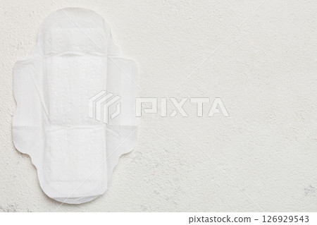 Women hygiene products or sanitary pad on colored background. Pastel color. Closeup. Empty place for text. Female daily hygiene 126929543
