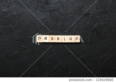 passion word written on wood block. passion text on table, concept passion word written on wood block. passion text on table, concept 126929680