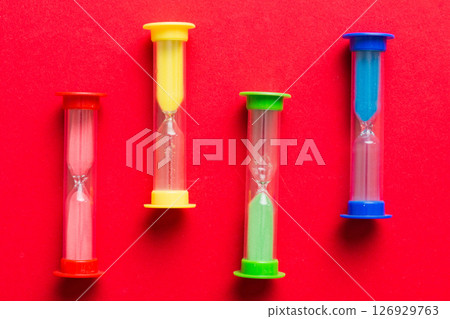 hourglass on the table, sand clock as time passing concept for business deadline, copy space 126929763