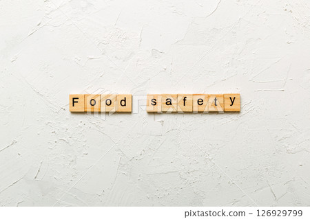 food safety word written on wood block. food safety text on table, concept food safety word written on wood block. food safety text on table, concept 126929799
