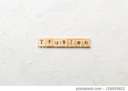 trustee word written on wood block. trustee text on table, concept 126929822