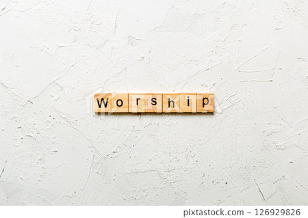 Worship word written on wood block. Worship text on cement table for your desing, concept 126929826