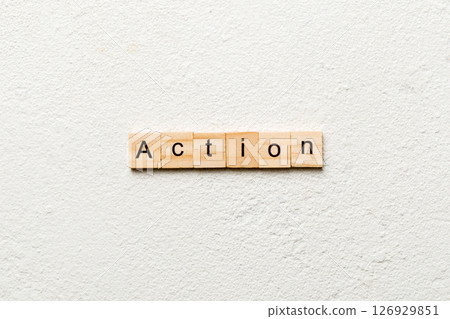 Action word written on wood block. Action text on table, concept 126929851