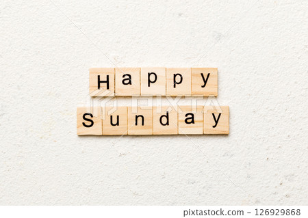 Happy sunday word written on wood block. Happy sunday text on cement table for your desing, concept 126929868