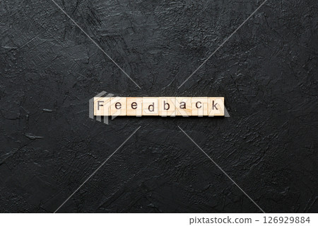 feedback word written on wood block. feedback text on cement table for your desing, concept feedback word written on wood block. feedback text on cement table for your desing, concept 126929884
