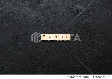 focus word written on wood block. focus text on table, concept focus word written on wood block. focus text on table, concept 126929886