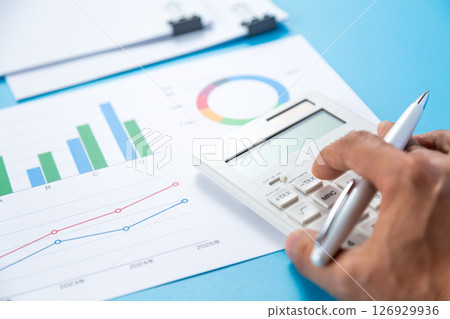 Clipped documents, graphs and a calculator Clipped documents, graphs and a calculator 126929936
