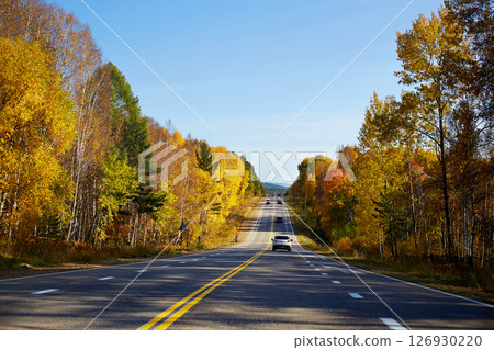 Beautiful asphalt roadway to lake Baikal on a Sunny autumn day. 126930220