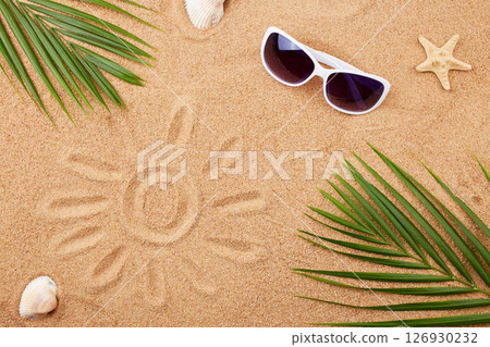 Summer background. Sunglasses, shells and palm leaves on the sand on the beach. Summer background. Sunglasses, shells and palm leaves on the sand on the beach. 126930232