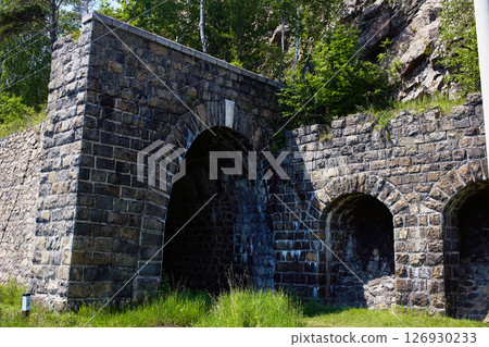 Italian wall and tunnel on the coast of Lake Baikal. Circum-Baikal railroad on summer. 126930233