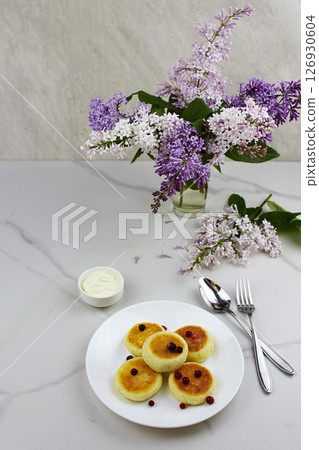 Cheesecakes syrniki, curd fritters with with sour cream Cheesecakes syrniki, curd fritters with with sour cream 126930604
