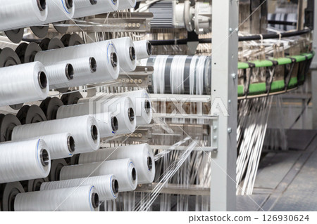 A range of equipment with spools of polypropylene threads. A range of equipment with spools of polypropylene threads. 126930624