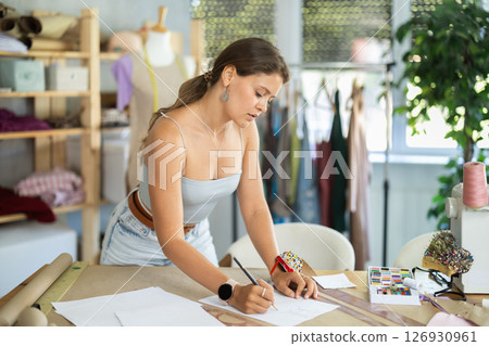 Woman drawing sketch on paper Woman drawing sketch on paper 126930961