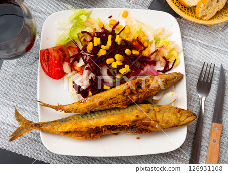 Fried mackerel with vegetables and corn grains Fried mackerel with vegetables and corn grains 126931108