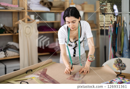 Armenian woman works as a fashion designer and draws patterns 126931361