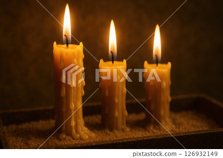 Burning orthodox religious candles with melting wax drips illuminating a serene spiritual atmosphere during reflection or prayer, AI Generative Burning orthodox religious candles with melting wax drips illuminating a serene spiritual atmosphere during reflection or prayer, AI Generative 126932149