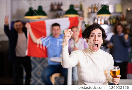 Enthusiastic Peruvian fans scream with joy in beer bar. Peruvian win Enthusiastic Peruvian fans scream with joy in beer bar. Peruvian win 126932566