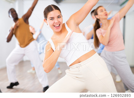 Young woman learning dance in dance studio 126932893